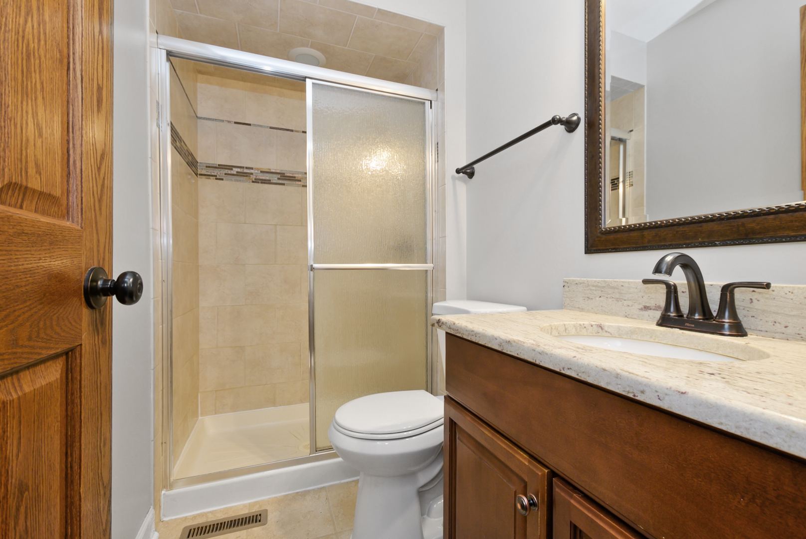433 Hackberry Road Frankfort, IL 60423 - Photo 14 of 27 a bathroom with a granite countertop sink toilet and shower