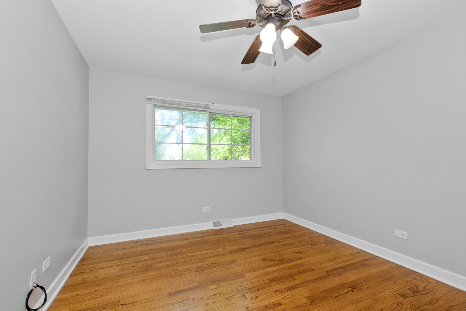 433 Hackberry Road Frankfort, IL 60423 - Photo 15 of 27 an empty room with windows and fan