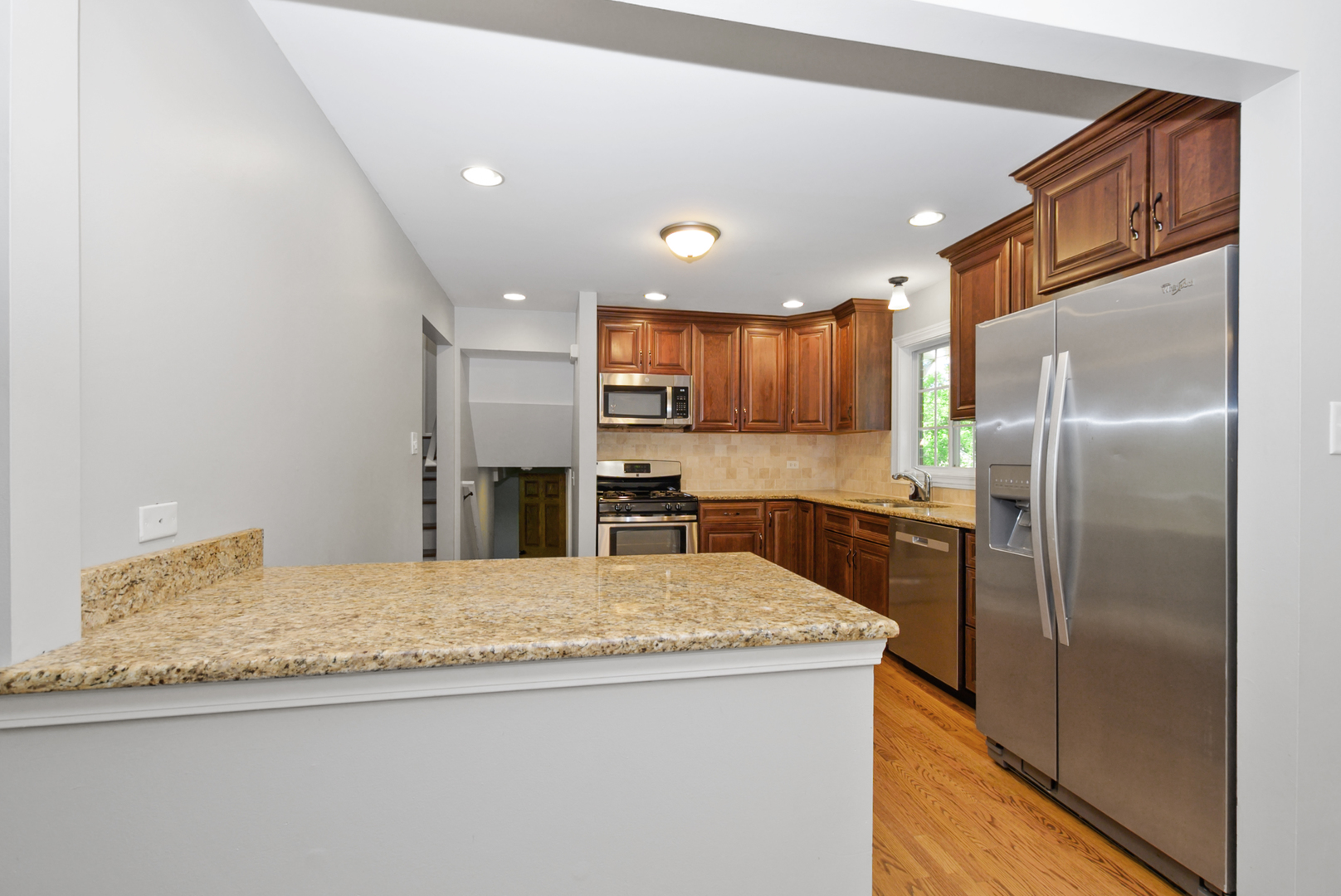 433 Hackberry Road Frankfort, IL 60423 - Photo 6 of 27 a kitchen with a refrigerator a oven and a sink