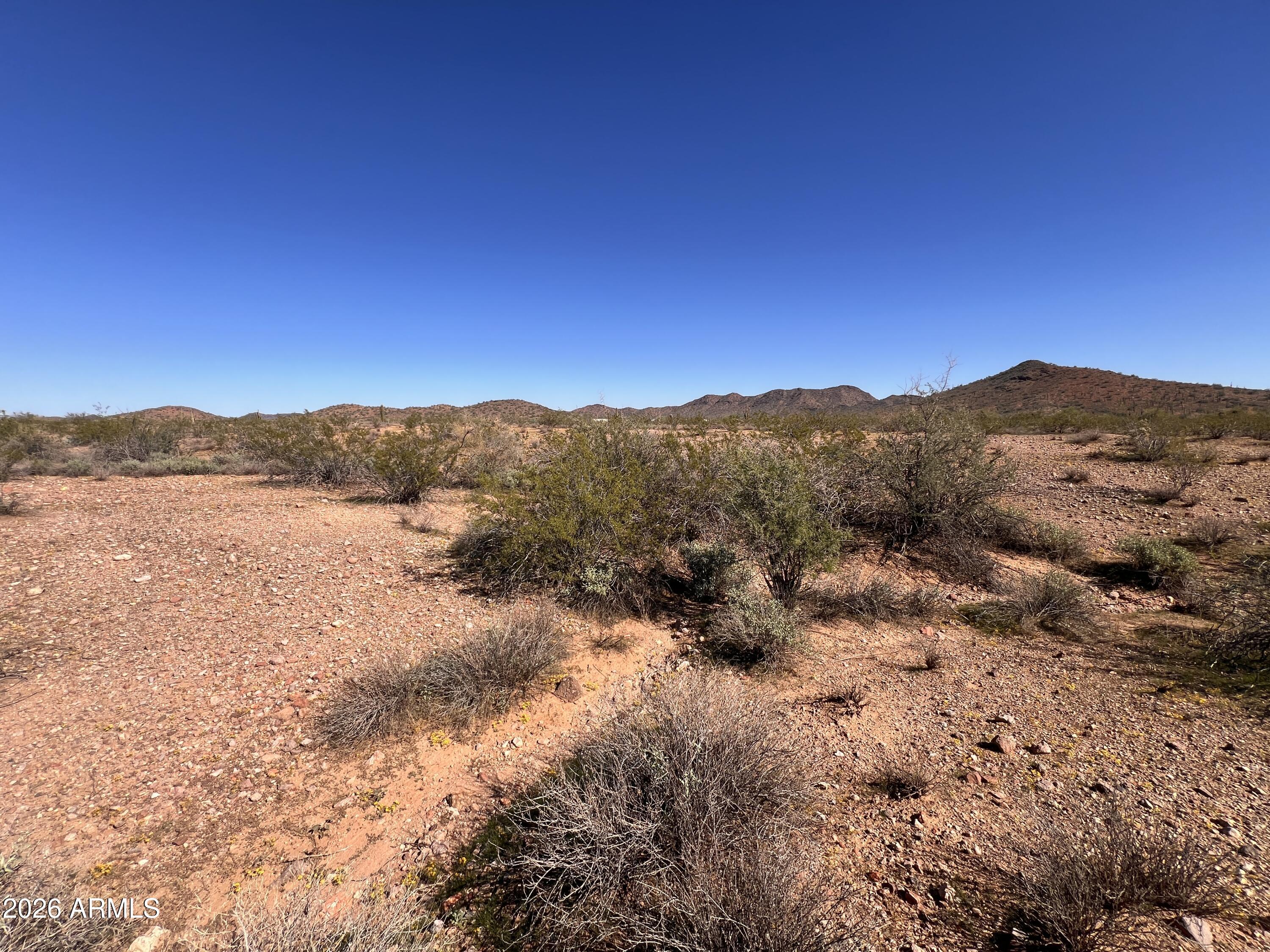 31-xxx West Carlise Road, Unit 105 Wittmann, AZ 85361 - Photo 6 of 9 a view of mountain with lake