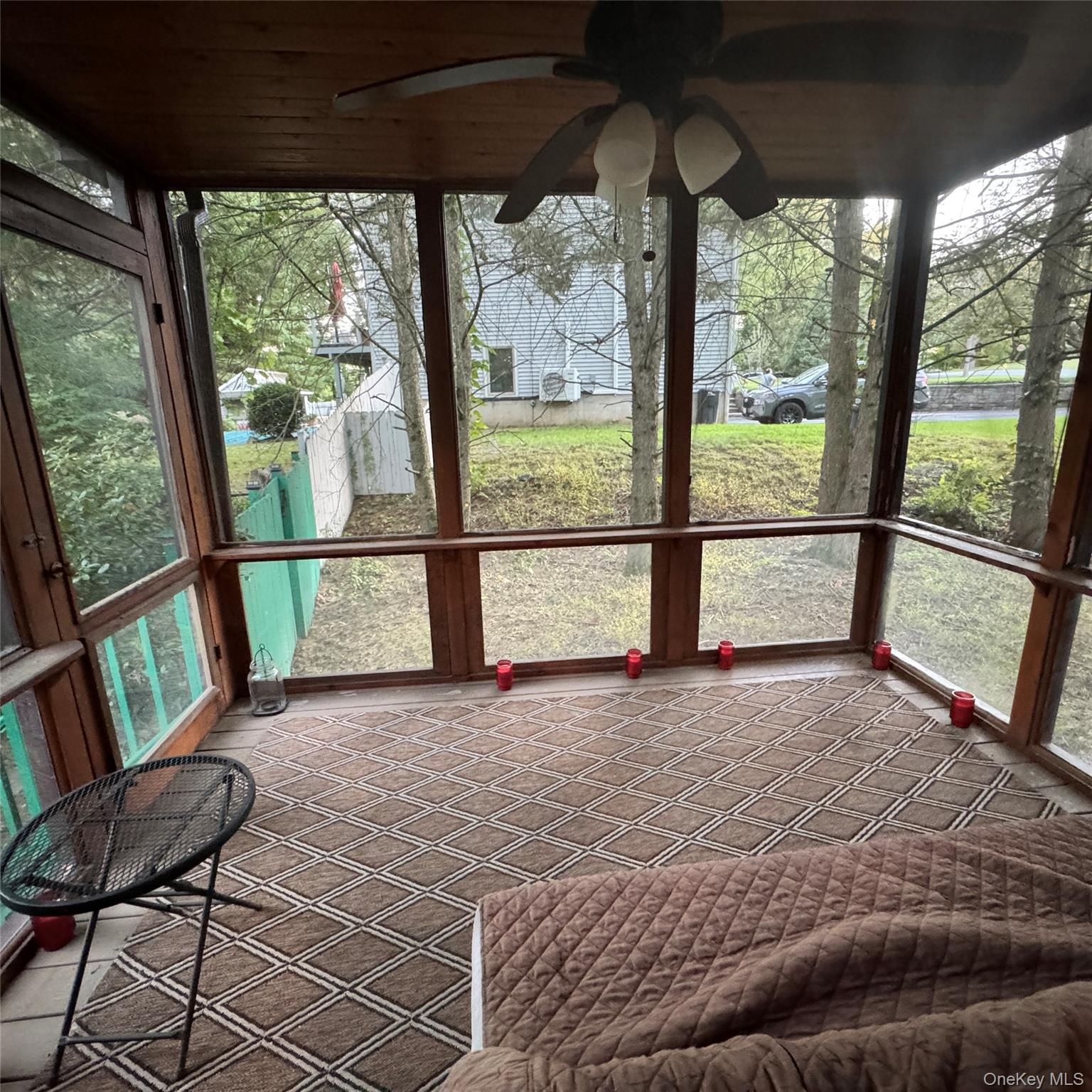 67 Steele Road New Windsor, NY 12553 - Photo 25 of 34 Screened porch featuring wood-frame construction and a ceiling-mounted fan with integrated lighting