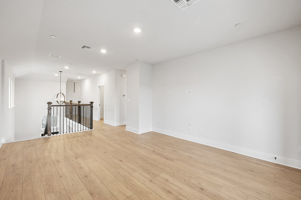 6313 Leftwich Cove Austin, TX 78738 - Photo 30 of 39 a view of a hallway with wooden floor
