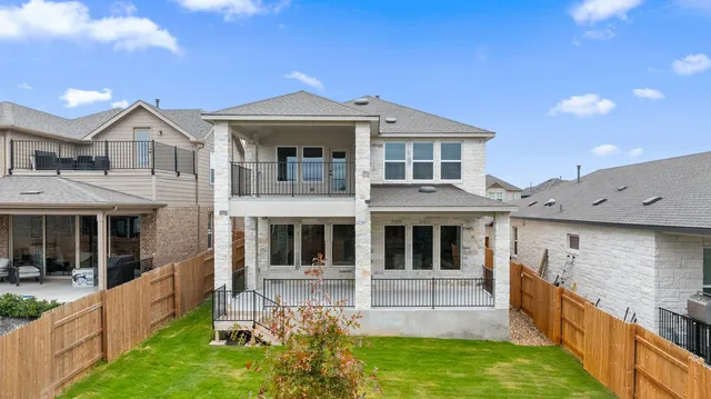a front view of a house with yard