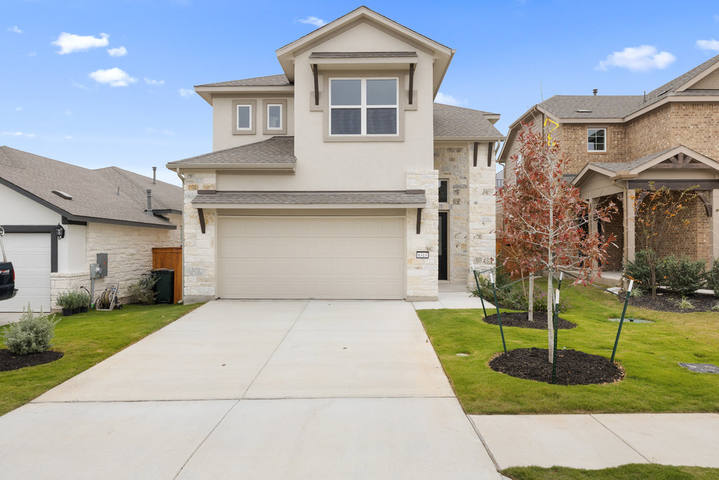 6313 Leftwich Cove Austin, TX 78738 - Photo 6 of 39 a front view of a house with garden