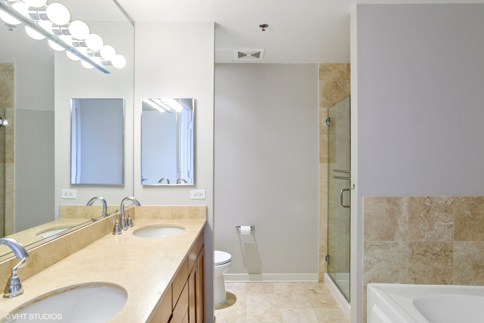 600 West Drummond Place, Unit 511 Chicago, IL 60614 - Photo 13 of 17 a bathroom with a granite countertop sink and a mirror