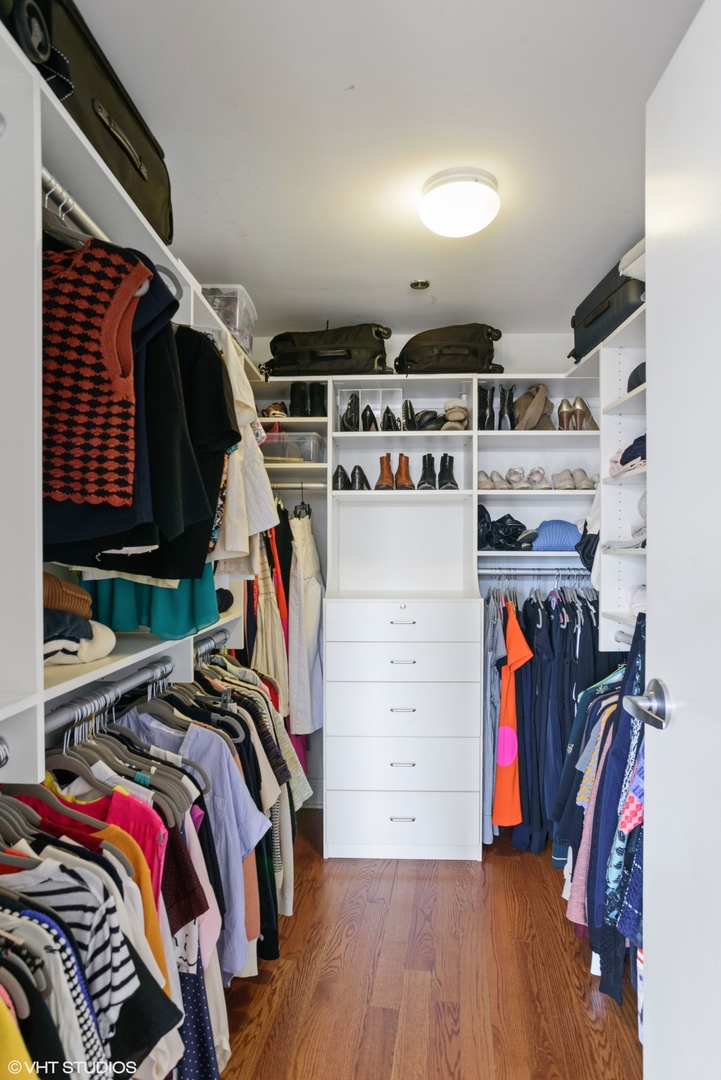 600 West Drummond Place, Unit 511 Chicago, IL 60614 - Photo 14 of 17 a view of walk in closet with clothes and shoes