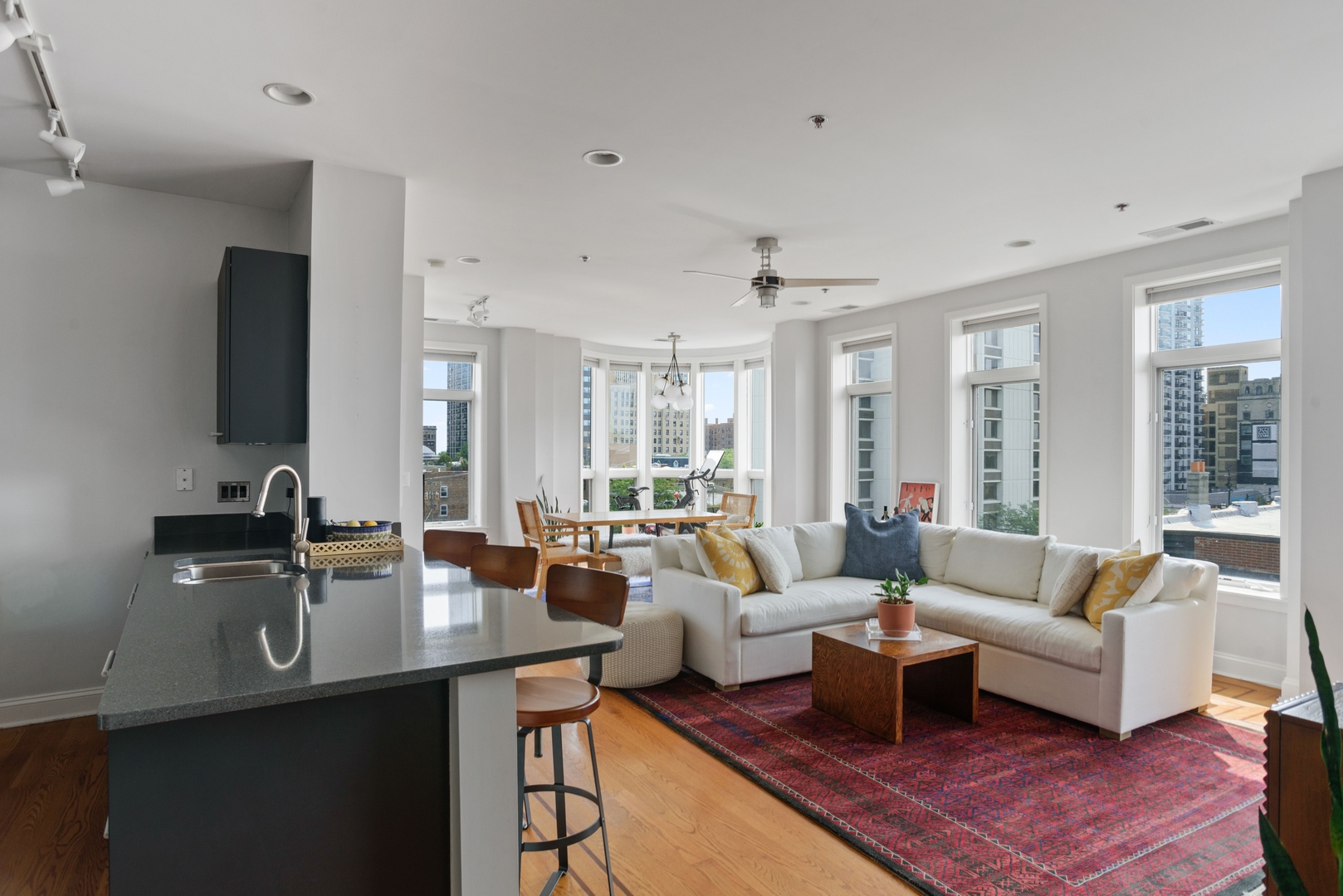 600 West Drummond Place, Unit 511 Chicago, IL 60614 - Photo 2 of 17 a living room with furniture wooden floor and a flat screen tv