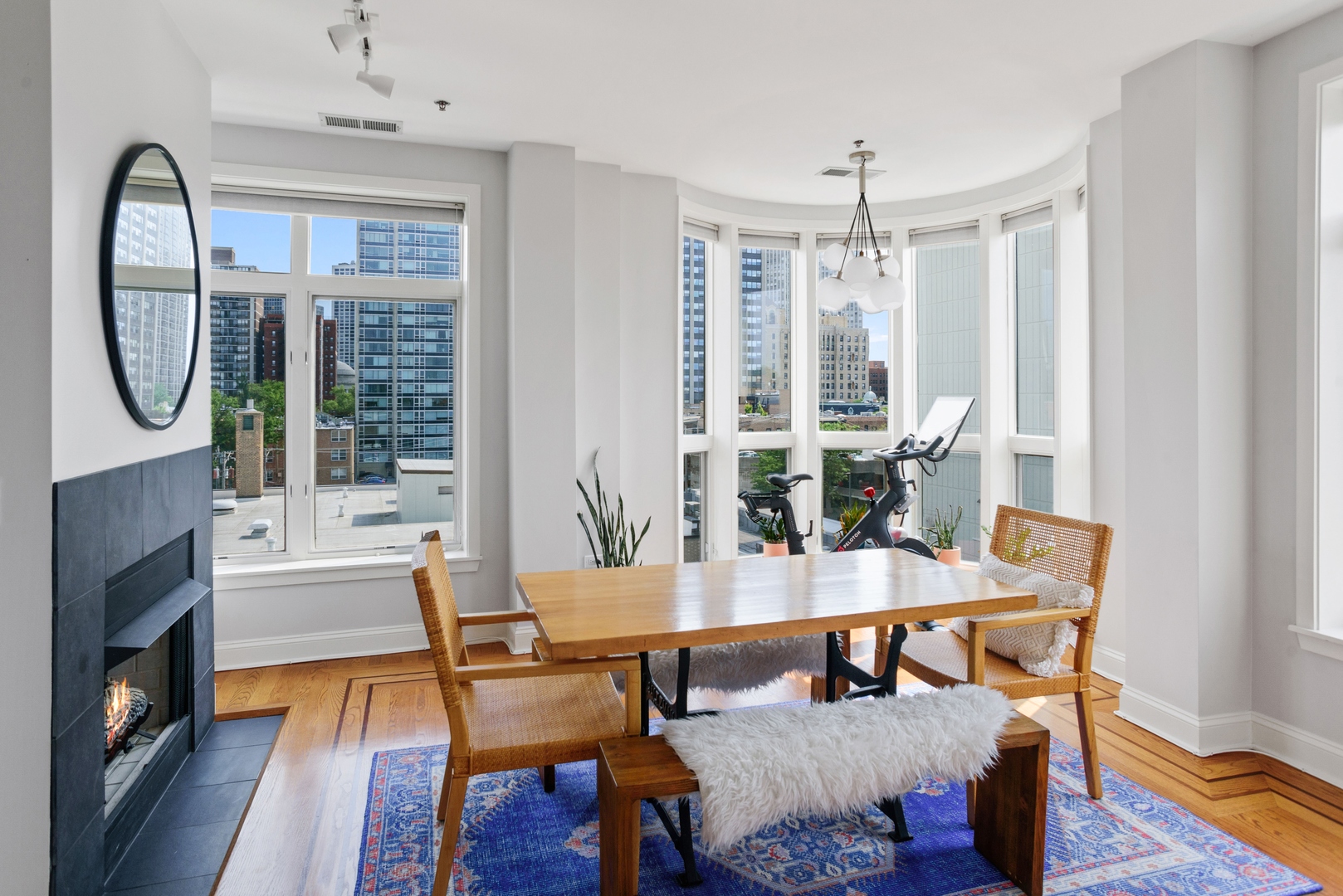 600 West Drummond Place, Unit 511 Chicago, IL 60614 - Photo 7 of 17 a dining room with furniture window and wooden floor