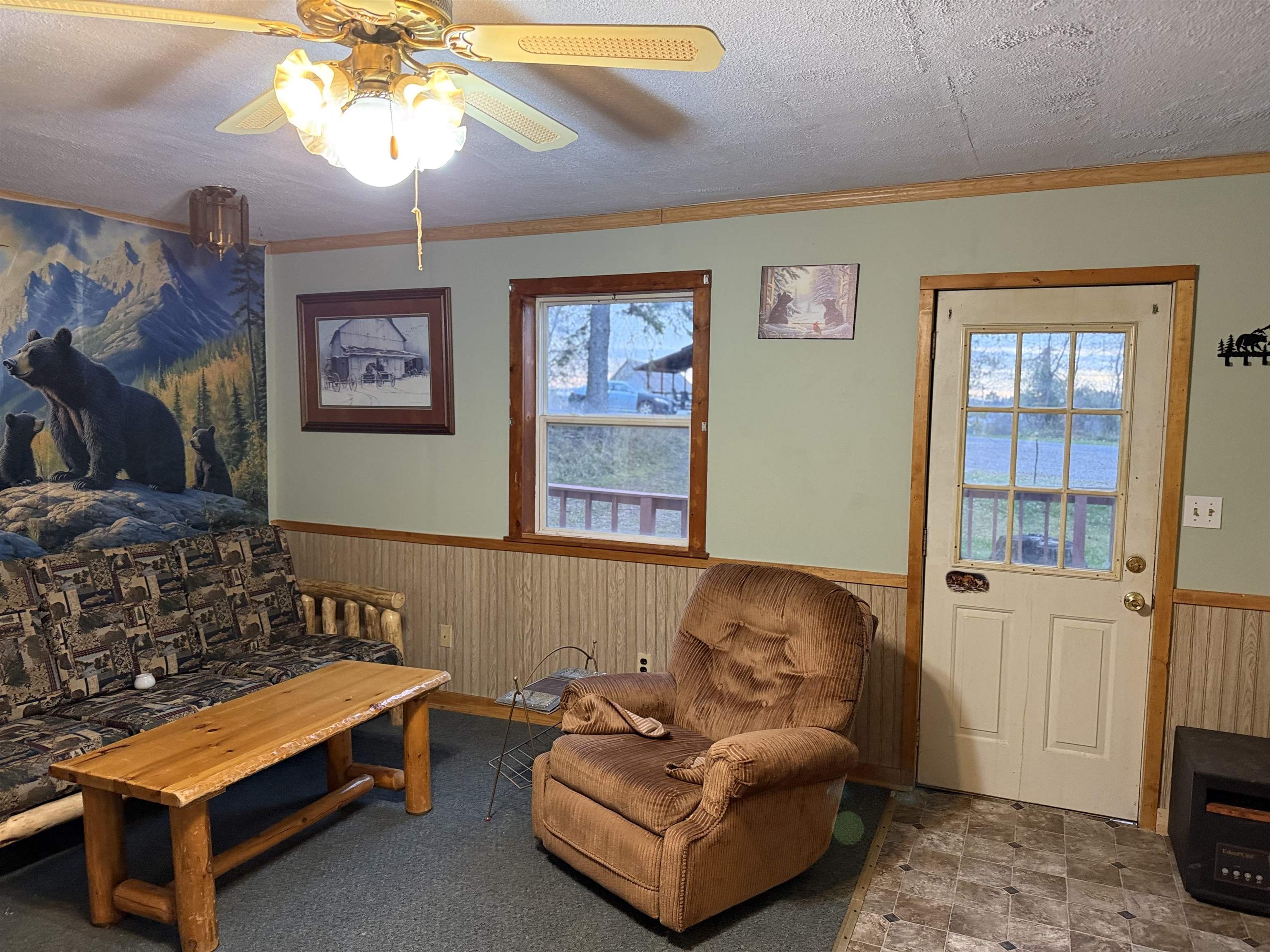 150 West 2nd Street Glidden, WI 54527 - Photo 14 of 32 Sitting room with wainscoting, ornamental molding, wood walls, and a ceiling fan