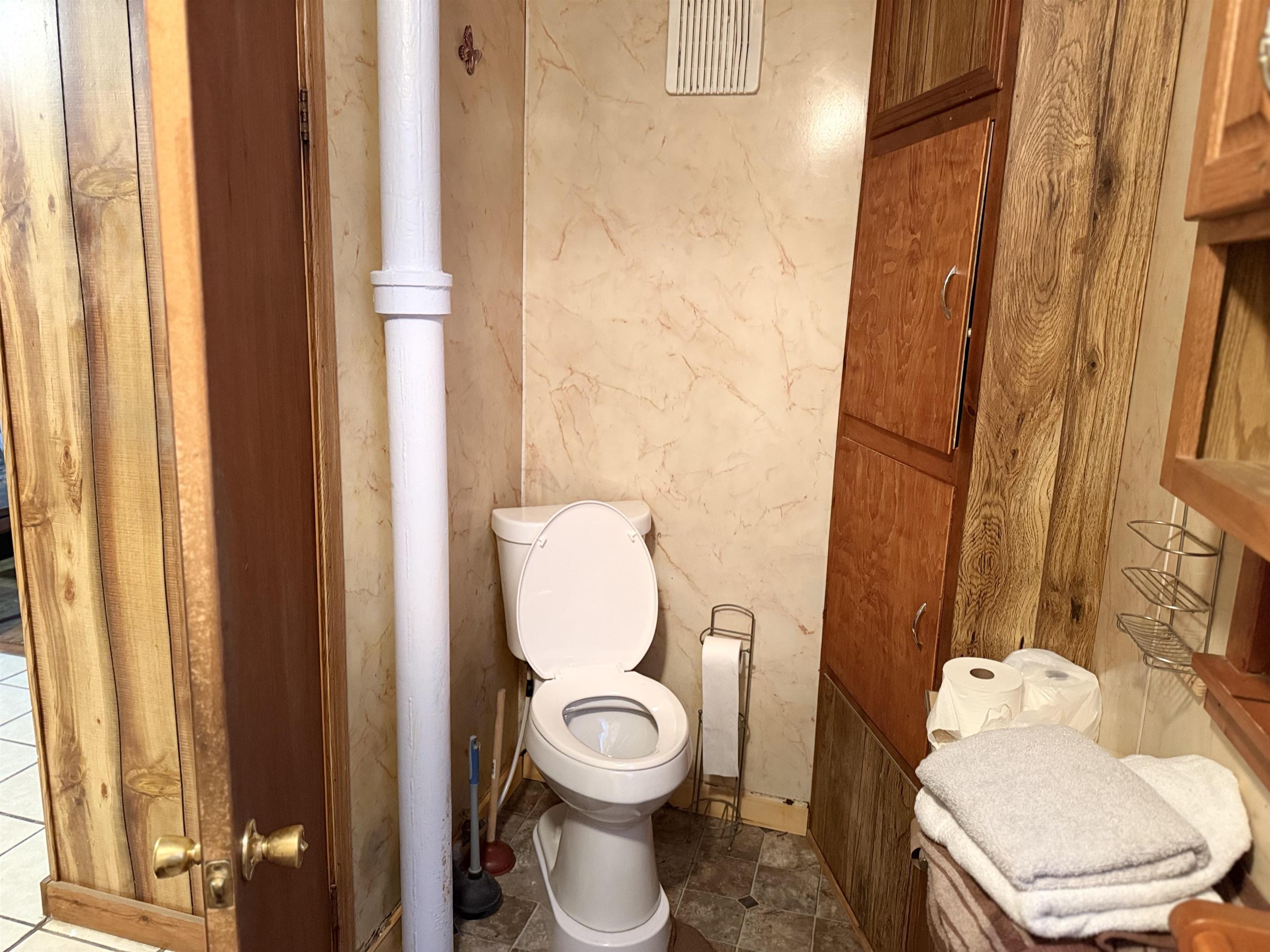150 West 2nd Street Glidden, WI 54527 - Photo 17 of 32 Bathroom featuring toilet and tile patterned flooring