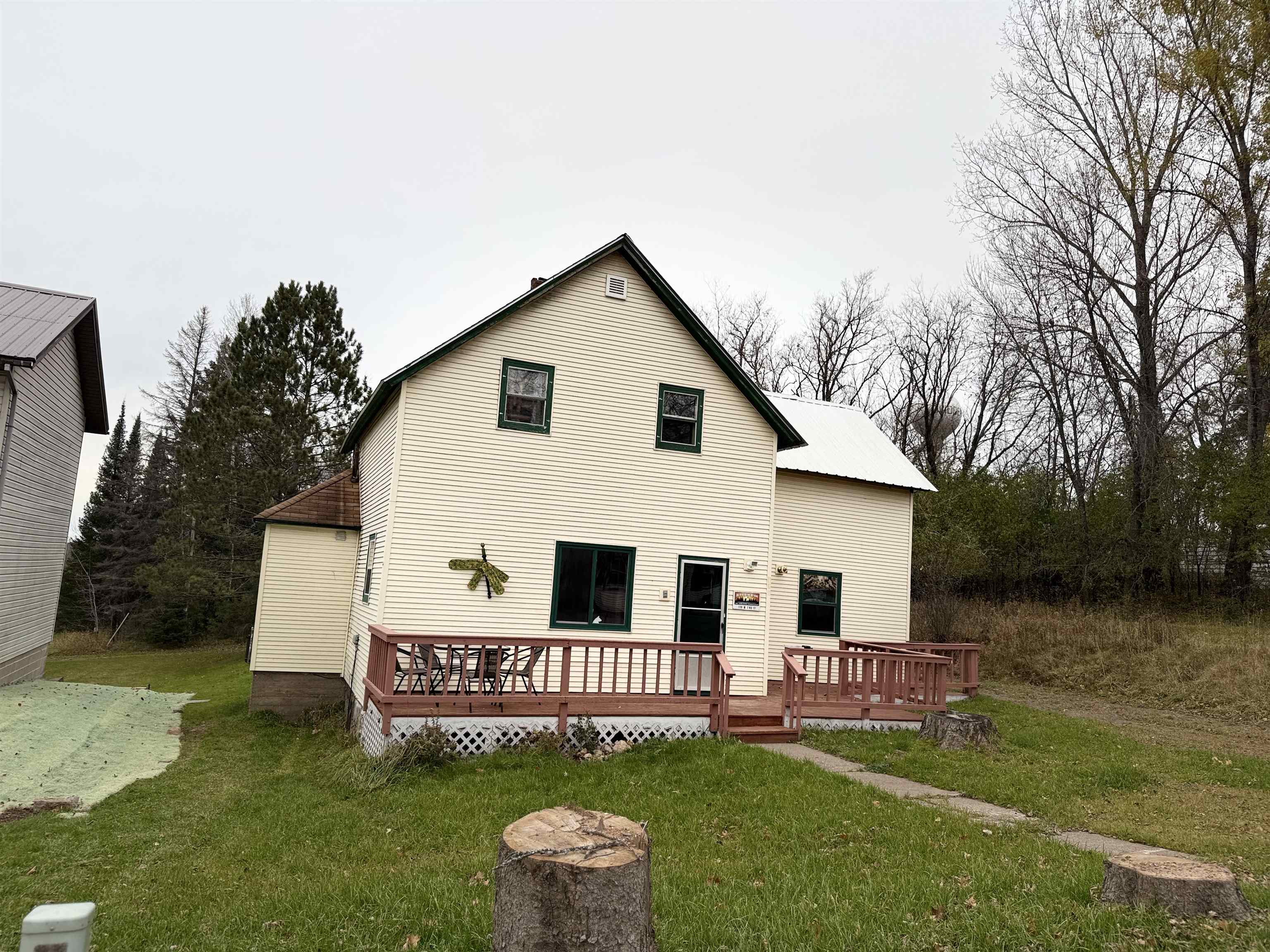 150 West 2nd Street Glidden, WI 54527 - Photo 2 of 32 Rear view of property with a deck and a lawn