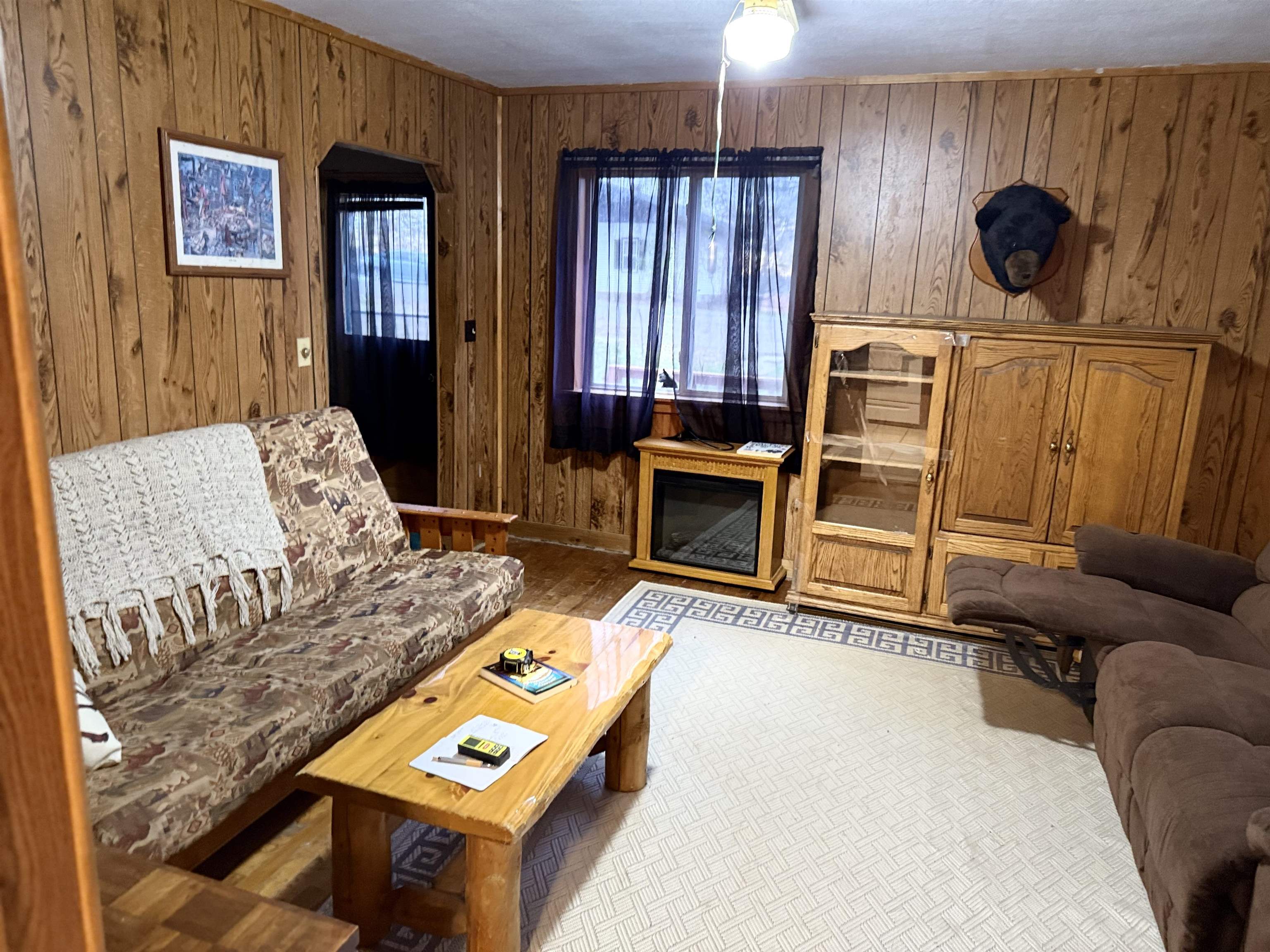 150 West 2nd Street Glidden, WI 54527 - Photo 6 of 32 Living area with wood walls