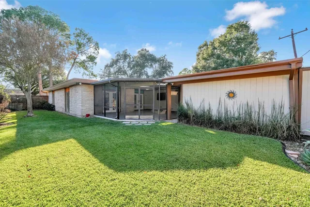 a view of a back yard with green space