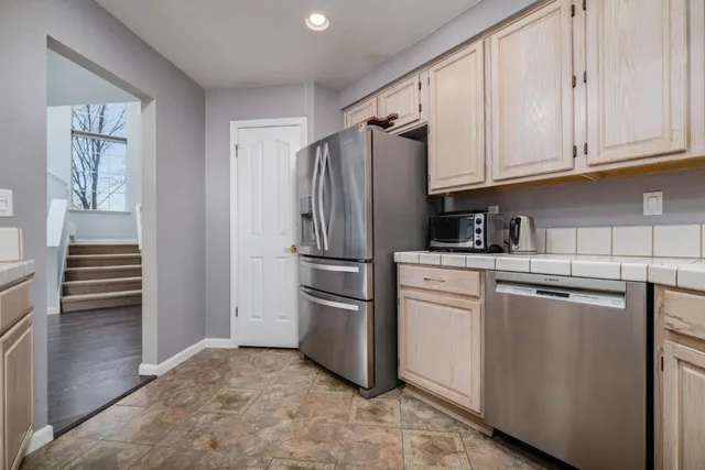 a bedroom with a bed and a lamp on table