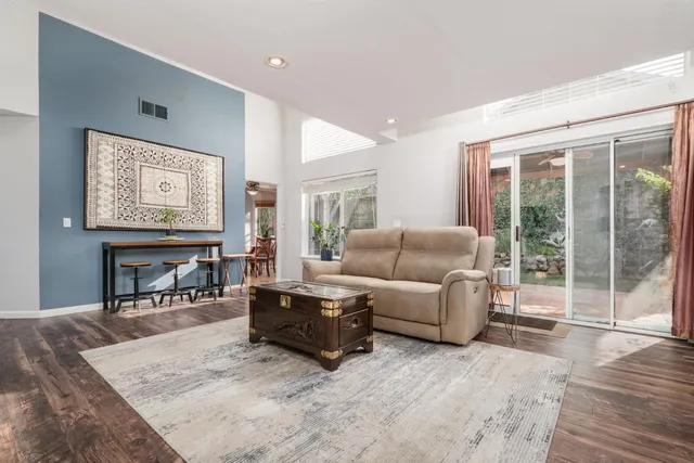 a view of a backyard with garden and porch