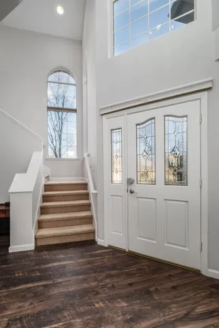 a view of a livingroom with furniture and staircase