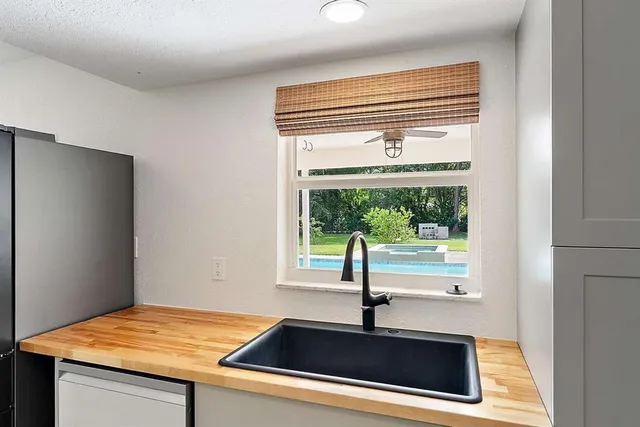 a kitchen with a sink and a window