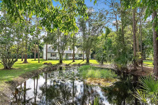 a view of swimming pool with sitting area