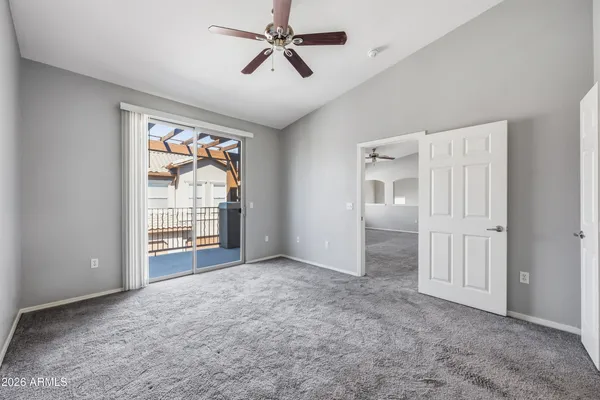 an empty room with windows and closet