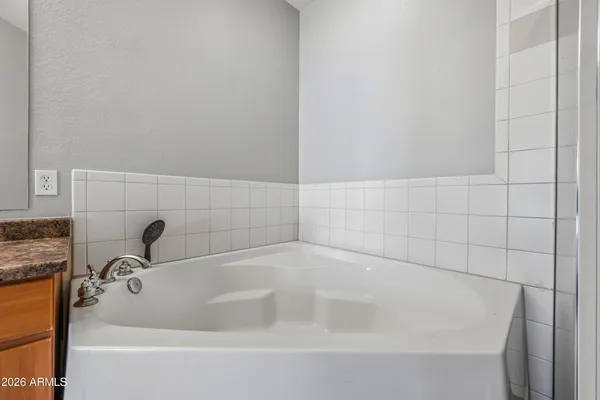 a white bath tub sitting in a bathroom