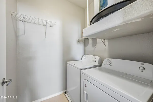 a utility room with dryer and washer