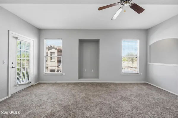 a view of an empty room with a window