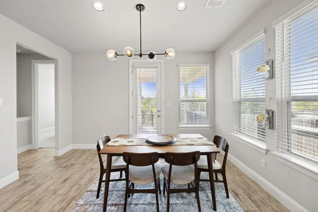 a kitchen with a sink a counter and chairs