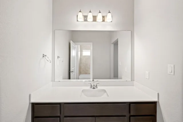 a view of an empty room and fire place