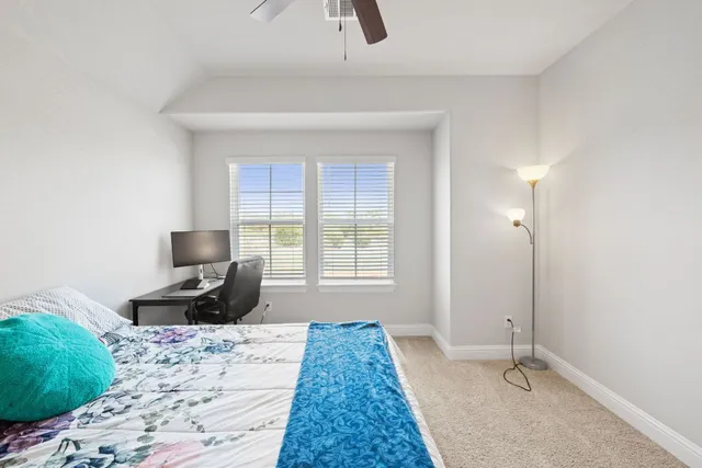 a bathroom with a shower and toilet