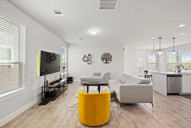 a living room with furniture and a flat screen tv