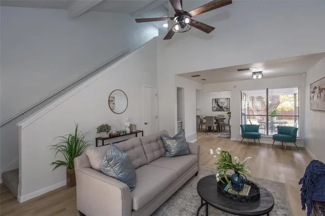 a living room with furniture and a potted plant