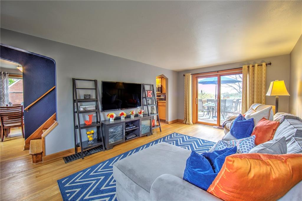 113 Leon Road Green Tree, PA 15220 - Photo 5 of 23 Living Space is comfortable with a cross-breeze from windows on almost every side, beautiful hardwood floors, and open views of the outdoor deck, dining room and kitchen.