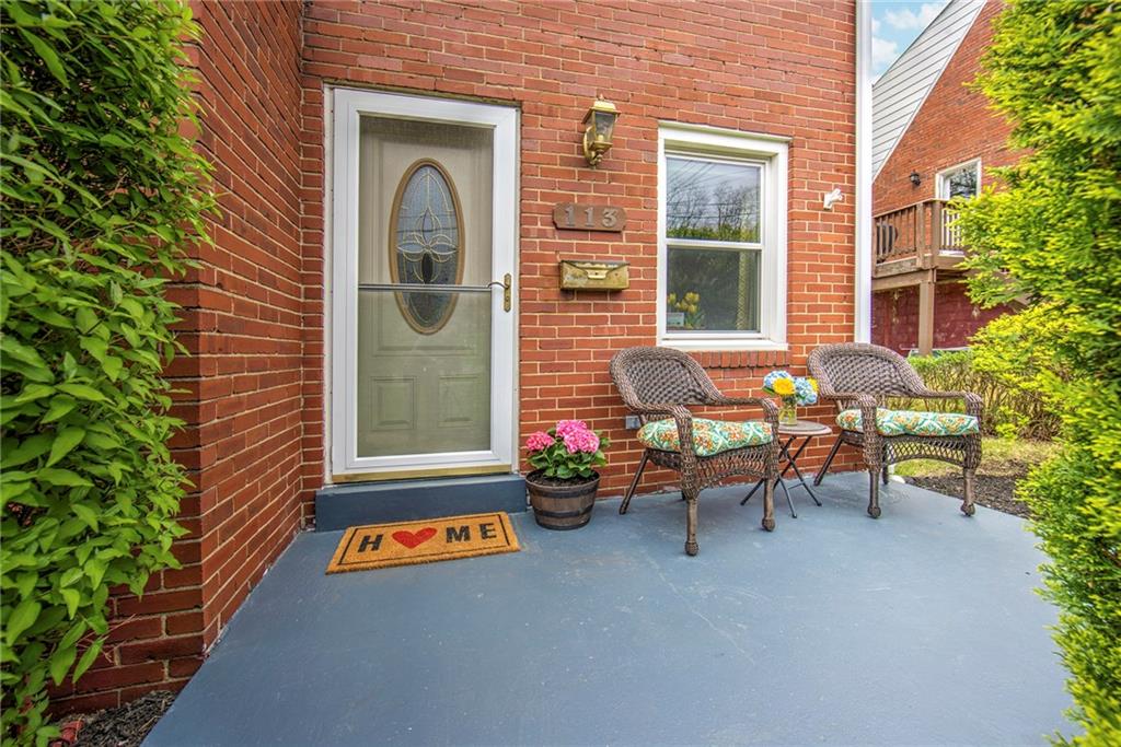 113 Leon Road Green Tree, PA 15220 - Photo 7 of 23 Privately secluded behind lush greenery, enjoy quiet mornings on the front patio. Great for an outdoor herb garden or patio garden.
