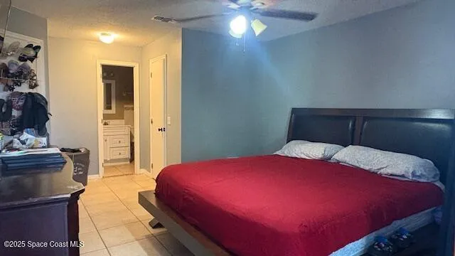 a bathroom with a toilet a sink a mirror and a shower