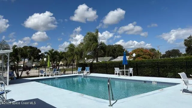 a view of a patio with couches table and chairs