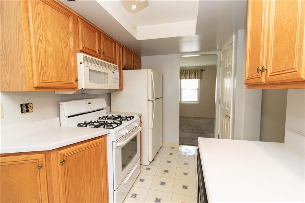 201 Kleber Road Glenshaw, PA 15116 - Photo 12 of 39 a kitchen with a stove a refrigerator and a sink