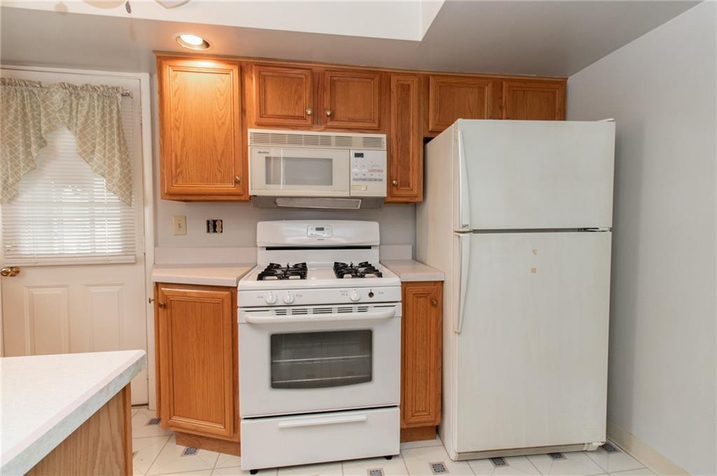 201 Kleber Road Glenshaw, PA 15116 - Photo 14 of 39 a kitchen with a stove top oven a refrigerator and a sink
