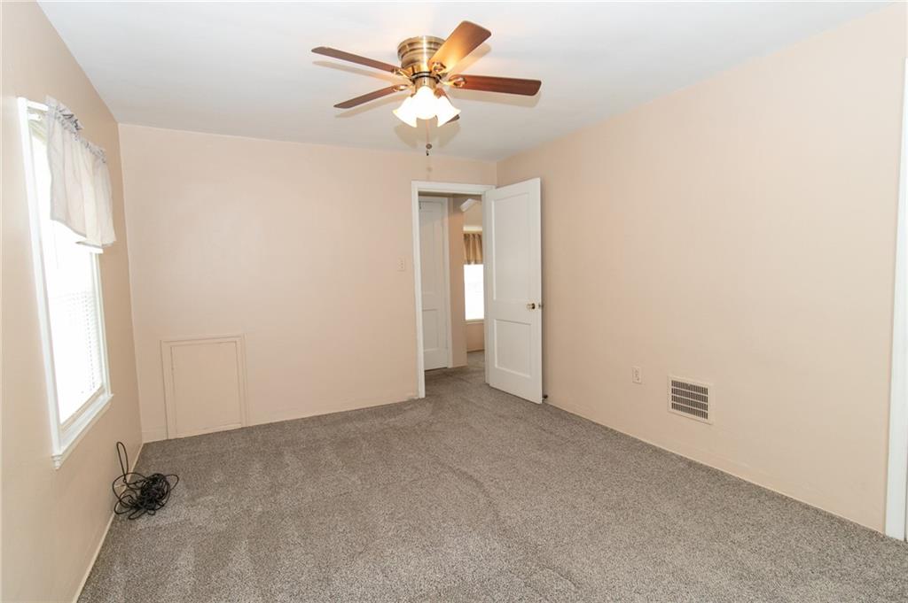 201 Kleber Road Glenshaw, PA 15116 - Photo 23 of 39 an empty room with a window and a fan