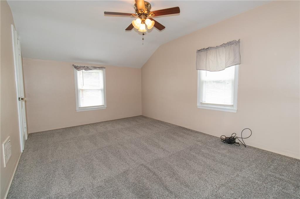 201 Kleber Road Glenshaw, PA 15116 - Photo 26 of 39 an empty room with windows and fan chandelier fan