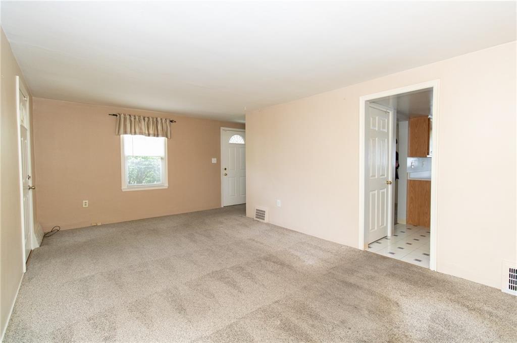 201 Kleber Road Glenshaw, PA 15116 - Photo 3 of 39 an empty room with windows