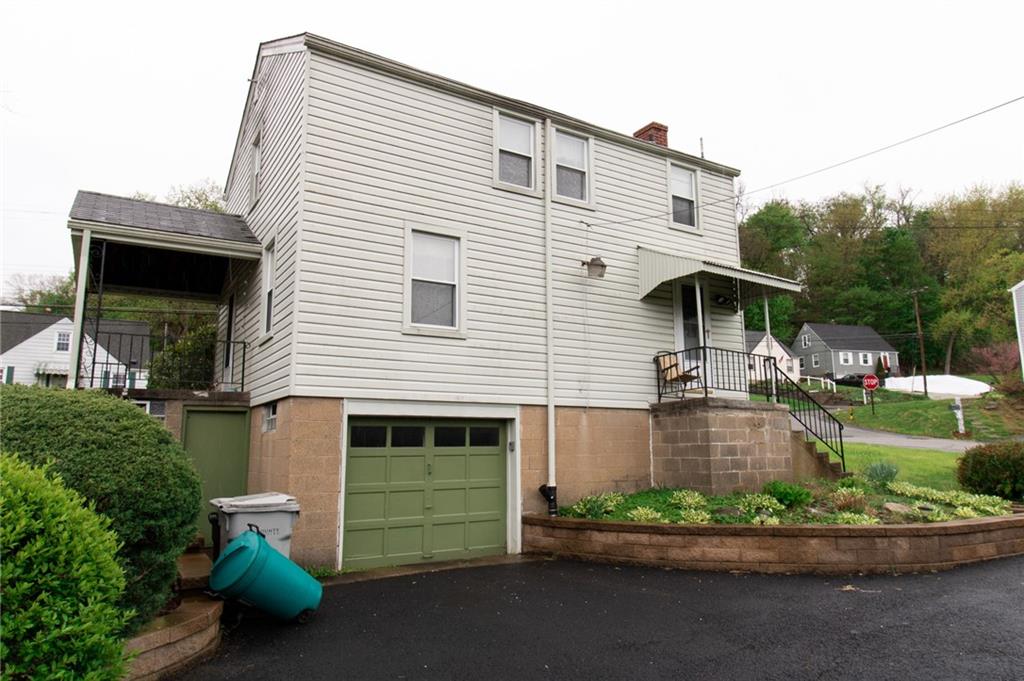 201 Kleber Road Glenshaw, PA 15116 - Photo 39 of 39 a front view of a house with a yard and potted plants