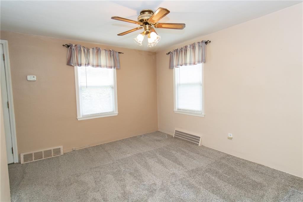 201 Kleber Road Glenshaw, PA 15116 - Photo 9 of 39 a view of an empty room with a window