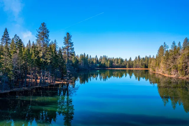 a view of lake with green space