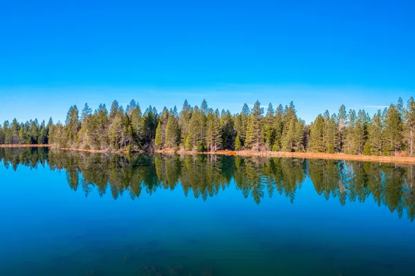 a view of a lake with a yard