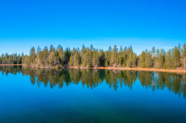 a view of a lake with a yard