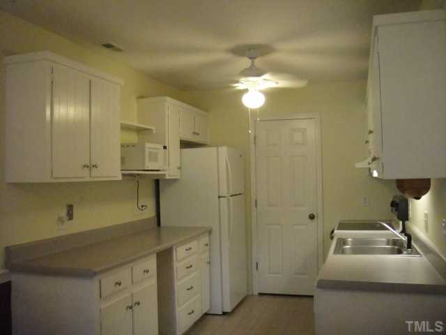 134 Towne View Trail Garner, NC 27529 - Photo 9 of 16 Spacious galley kitchen with smooth top range, range hood, dishwasher, microwave & refrigerator. Pantry, too!