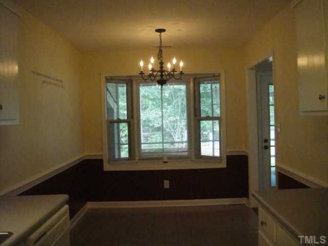 134 Towne View Trail Garner, NC 27529 - Photo 10 of 16 Breakfast with bay overlooks screen porch and wooded backyard.