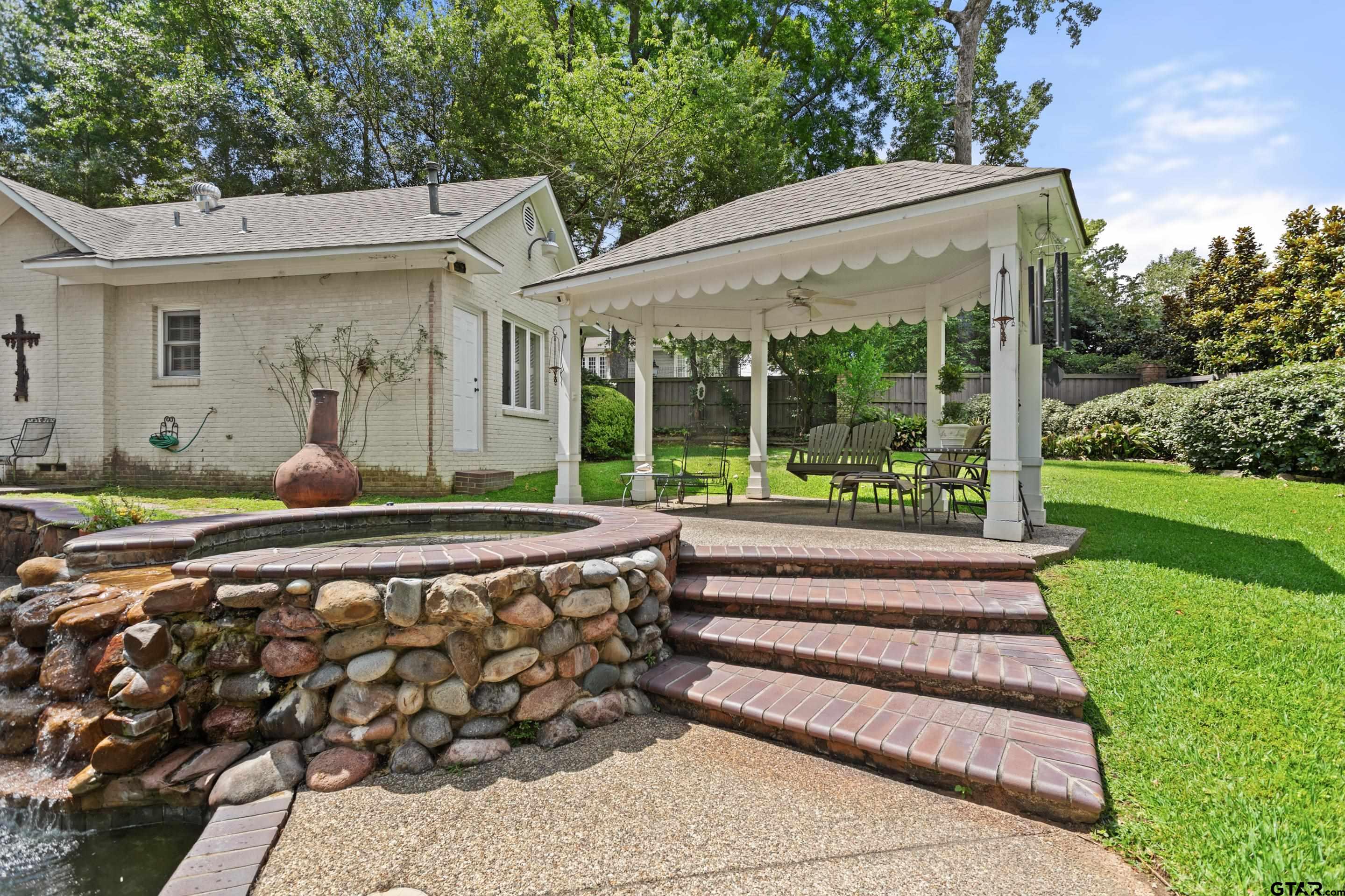 2631 Old Bullard Road Tyler, TX 75701 - Photo 41 of 43 a front view of a house with a yard garden and outdoor seating