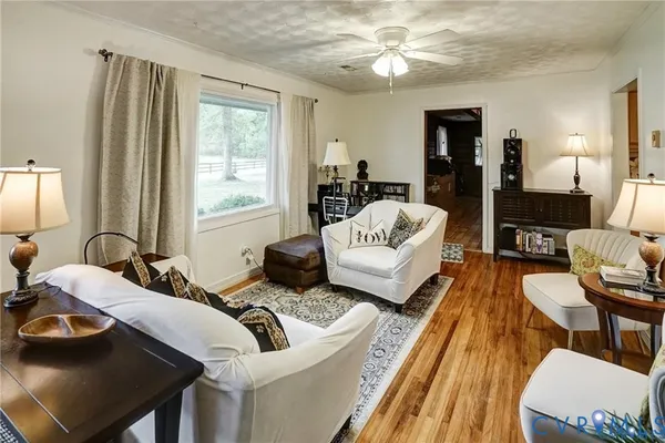 a spacious bedroom with two beds and a couch