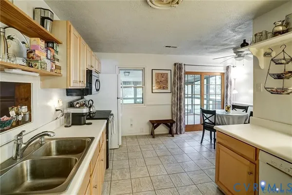 a kitchen that has a sink and cabinets